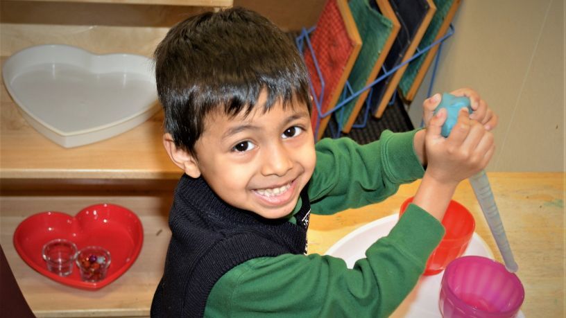 Child using kitchen utensil